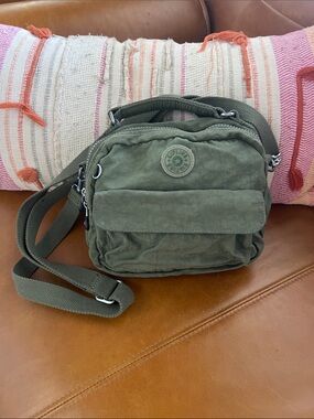 Kipling small multi pocket crossbody or hand held purse olive green